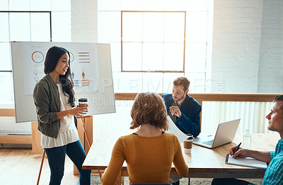 Buy stock photo Shot of a group of young businesspeople having a meeting in a modern office