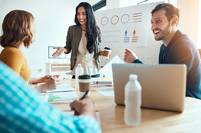 Buy stock photo Shot of a group of young businesspeople having a meeting in a modern office