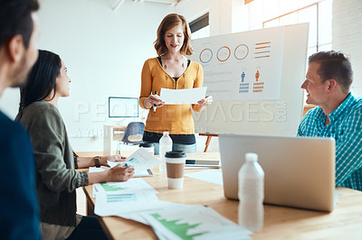 Buy stock photo Shot of a group of young businesspeople having a meeting in a modern office