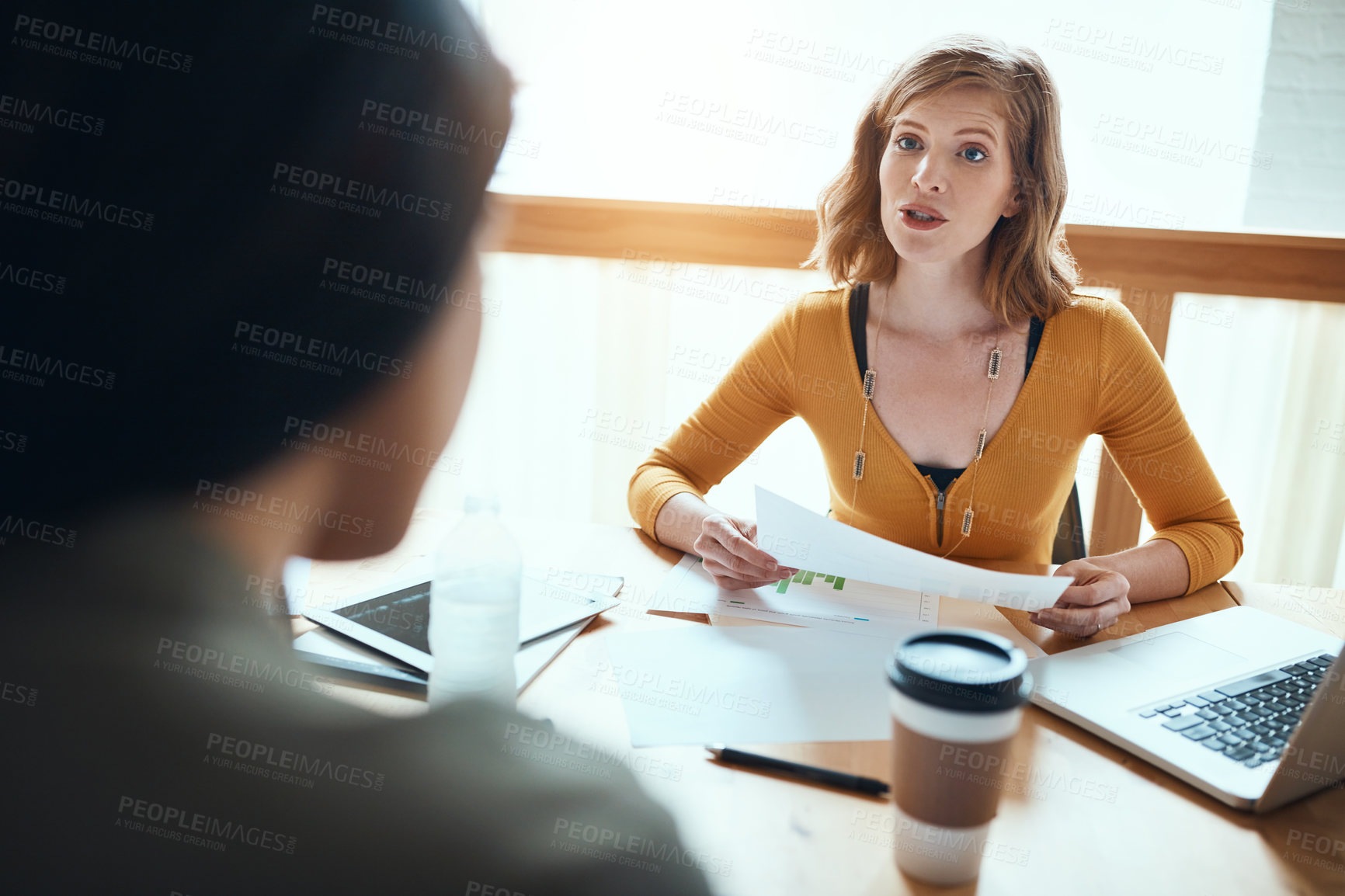 Buy stock photo Shot of young businesspeople having a meeting in a modern office