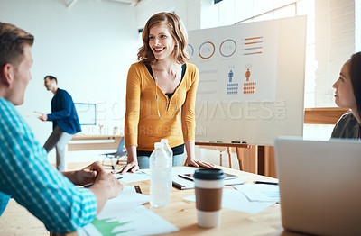 Buy stock photo Shot of a group of young businesspeople having a meeting in a modern office