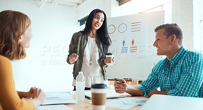 Buy stock photo Shot of a group of young businesspeople having a meeting in a modern office