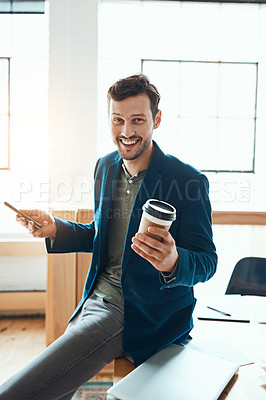 Buy stock photo Cropped portrait of a handsome young businessman using his cellphone while working in a modern office