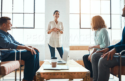 Buy stock photo Shot of a group of young businesspeople having a meeting in a modern office