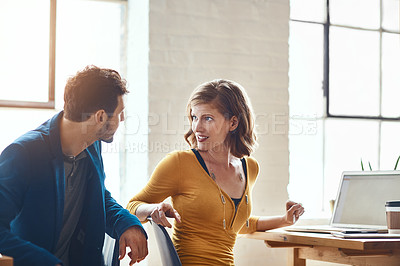 Buy stock photo Cropped shot of two young businesspeople working together in a modern office