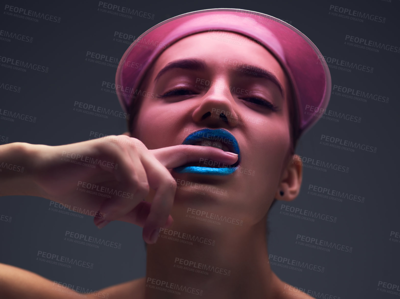 Buy stock photo Cosmetics, portrait and woman with neon visor, confidence and makeup for creative skincare in studio. Art, color and face of edgy girl with retro cap, skin glow or unique beauty on grey background