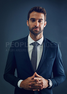 Buy stock photo Studio, business and dark portrait of man with confidence, corporate fashion or attorney at law firm. Businessman, legal consultant or lawyer with professional pride, serious style or blue background