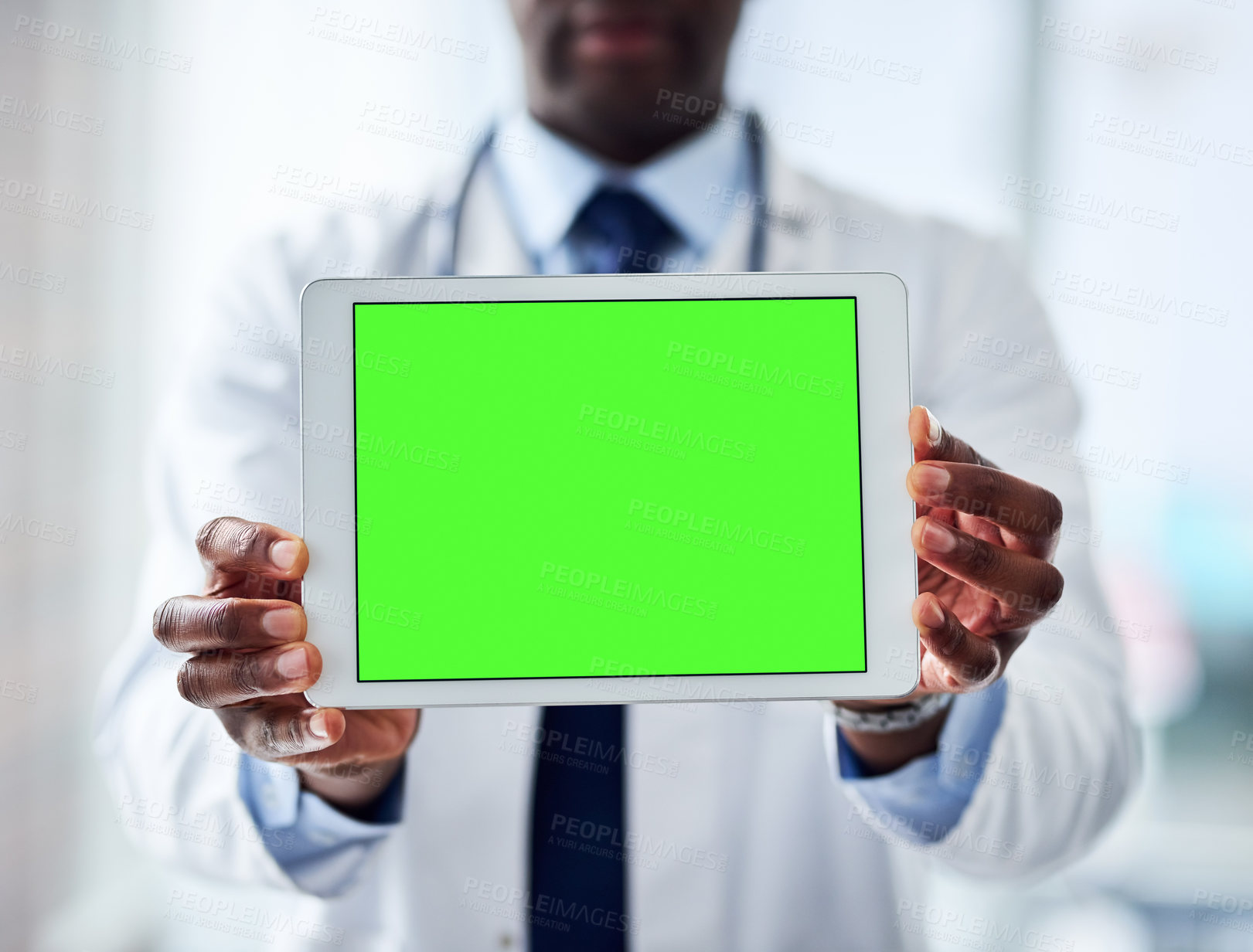 Buy stock photo Green screen, tablet and doctor hands at hospital with mockup for healthcare news, help or questions. Digital, space or man surgeon at clinic with how to, steps or Telehealth consulting app sign up