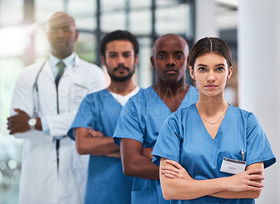 Buy stock photo Arms crossed, healthcare or leadership and portrait of nurse in hospital for collaboration you can trust. Confident, medical and serious woman with professional medicine team in clinic for treatment