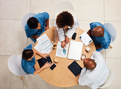 Buy stock photo Doctors, team and paperwork for healthcare in clinic, collaboration and top view of table. Employees, communication and documents for surgery agenda, solidarity and brainstorming for treatment plan