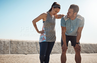 Buy stock photo Cropped shot of a young couple out for a run on the promenade