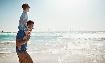 Buy stock photo Dad, beach and boy child on shoulders for walk, vacation and sunshine to relax with care, love or bonding. Man, father and son with piggy back, connection and outdoor by waves, ocean and mockup space