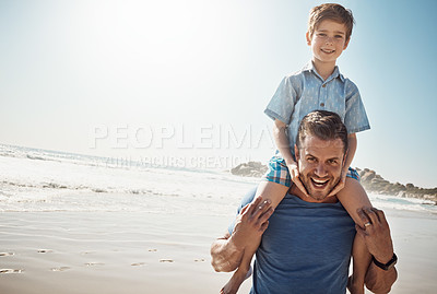 Buy stock photo Portrait of a father carrying his little son on his shoulders at the beach