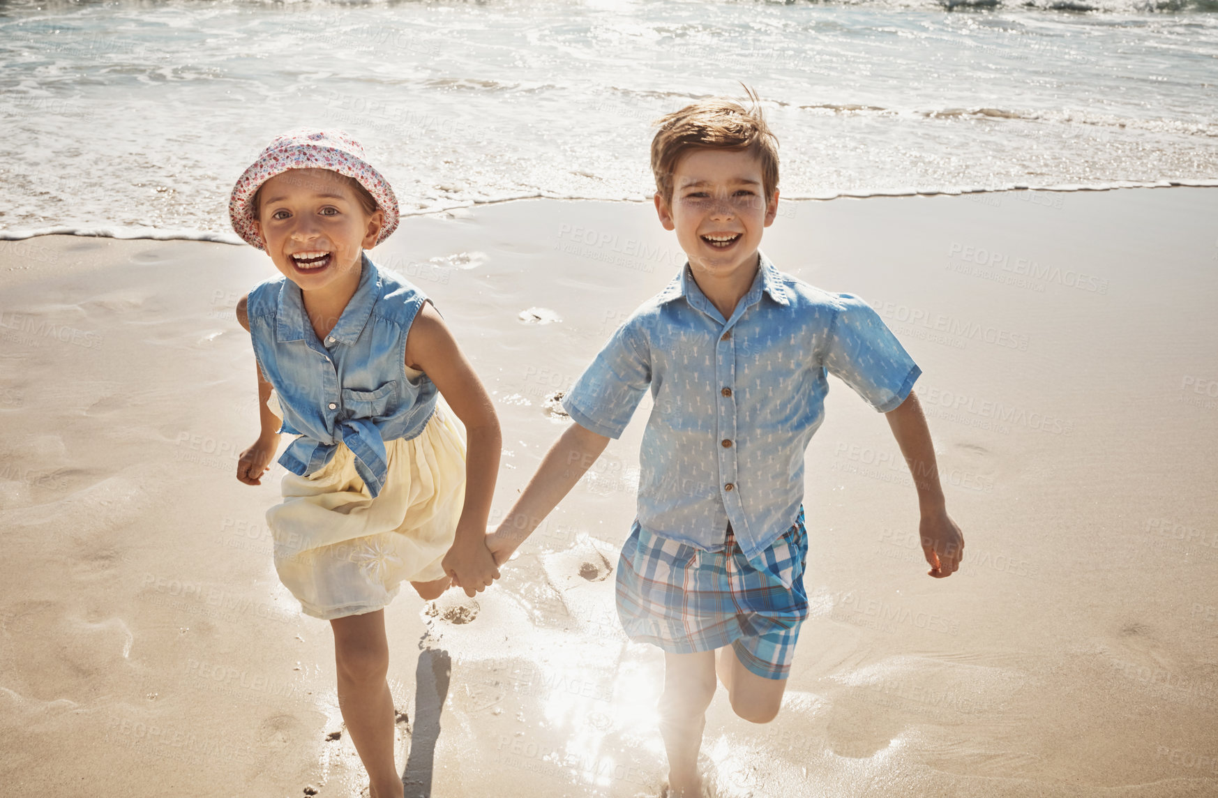 Buy stock photo Beach, happy and portrait of kids holding hands on holiday, vacation and tropical adventure. Family, summer and young boy and girl running in ocean for bonding, playing in waves and fun outdoors