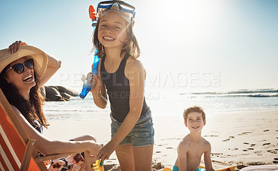 Buy stock photo Portrait of an adorable little girl having a fun day with her family at the beach