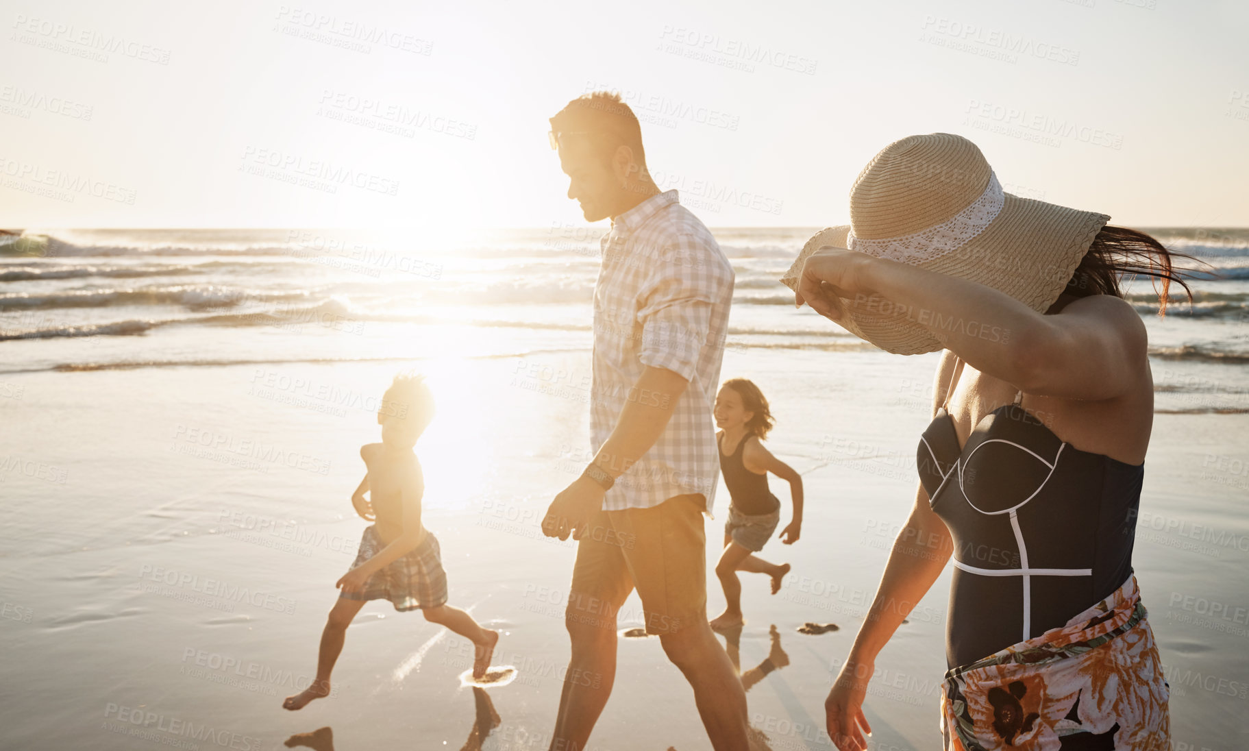 Buy stock photo Shot of a family of four spending the day at the beach