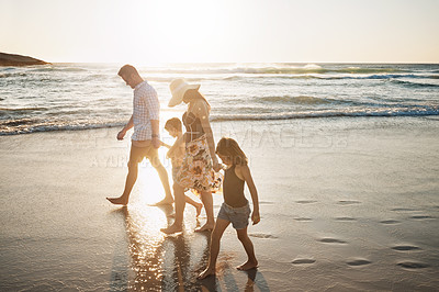 Buy stock photo Shot of a family of four spending the day at the beach