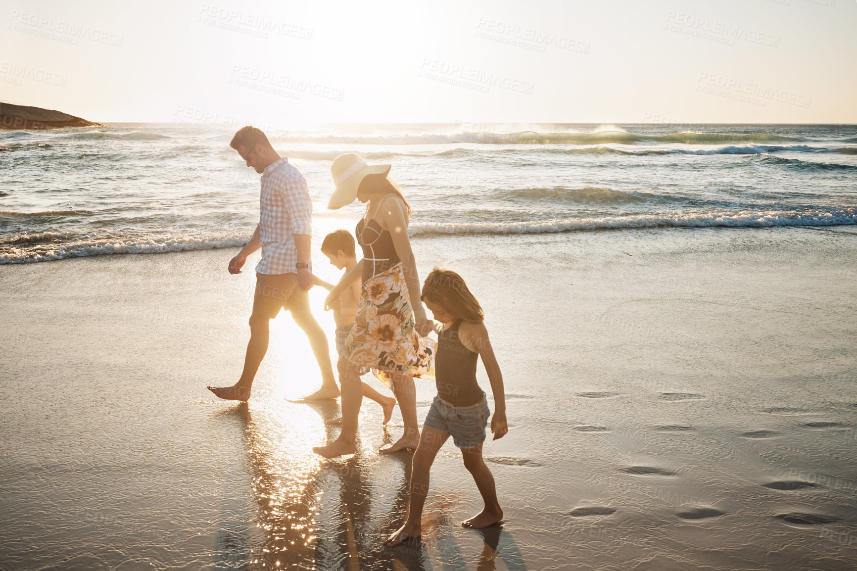 Buy stock photo Shot of a family of four spending the day at the beach