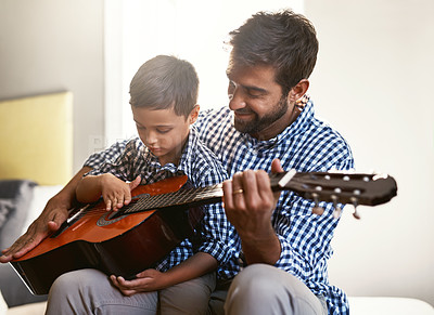 Buy stock photo Happy father, child and playing with guitar for music, sound or audio entertainment together at home. Dad, kid or little boy with musical instrument for playful morning, lesson or learning at house