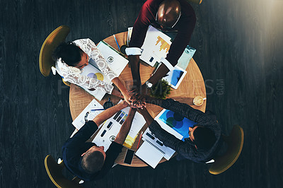 Buy stock photo Above, business people and hands stack at meeting, circle or support for motivation, teamwork and diversity. Men, women and solidarity in scrum by documents, technology and graphs at creative agency