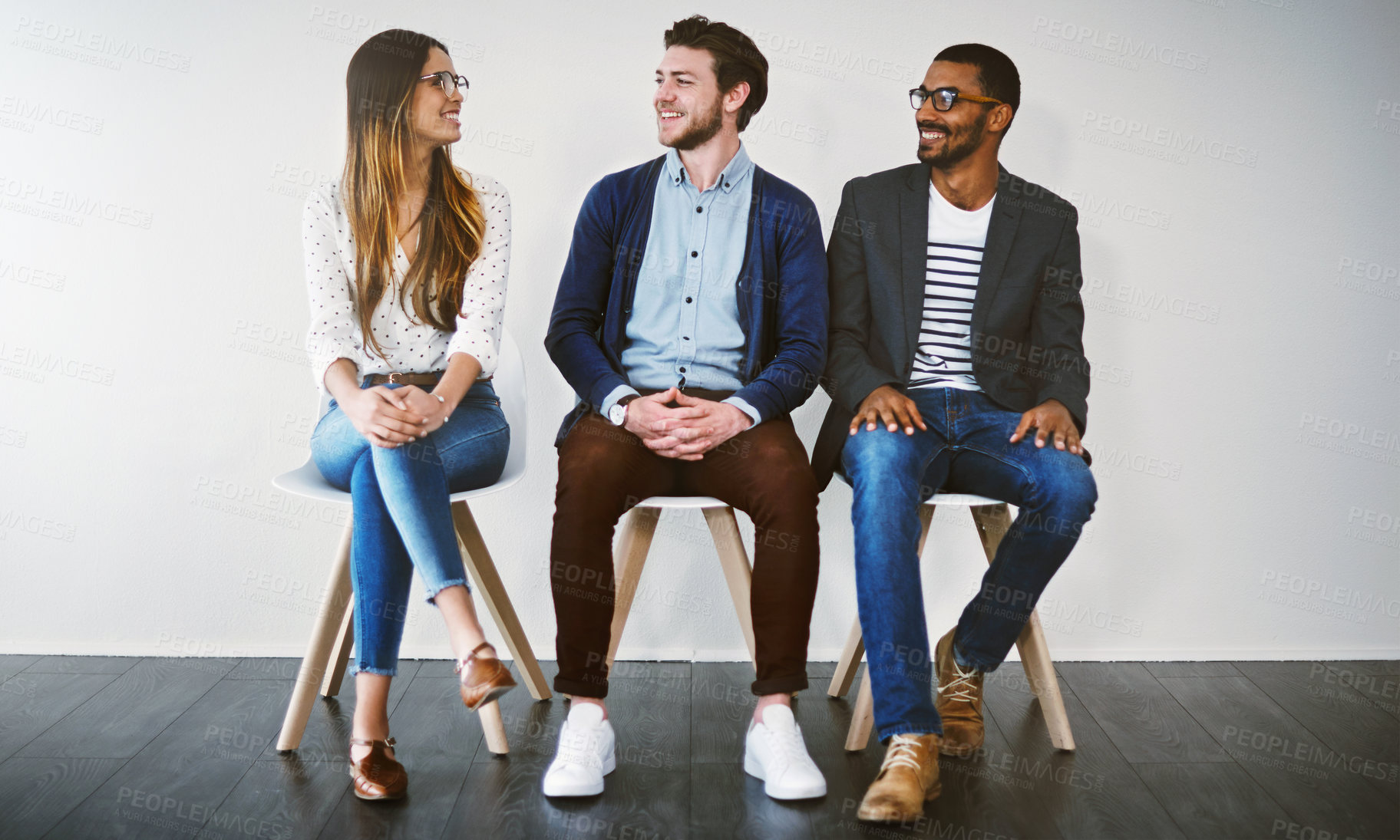 Buy stock photo Row, chair and group in waiting room, talking and professional in business, recruitment and smile. Appointment, applicant and people in line, job interview and process of hiring and onboarding