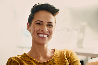 Buy stock photo Portrait of a confident young businesswoman sitting in an office