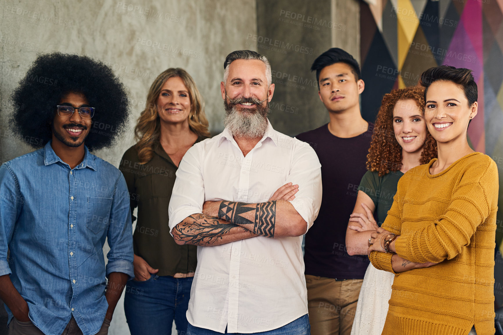 Buy stock photo Portrait of a group of designers standing in an office