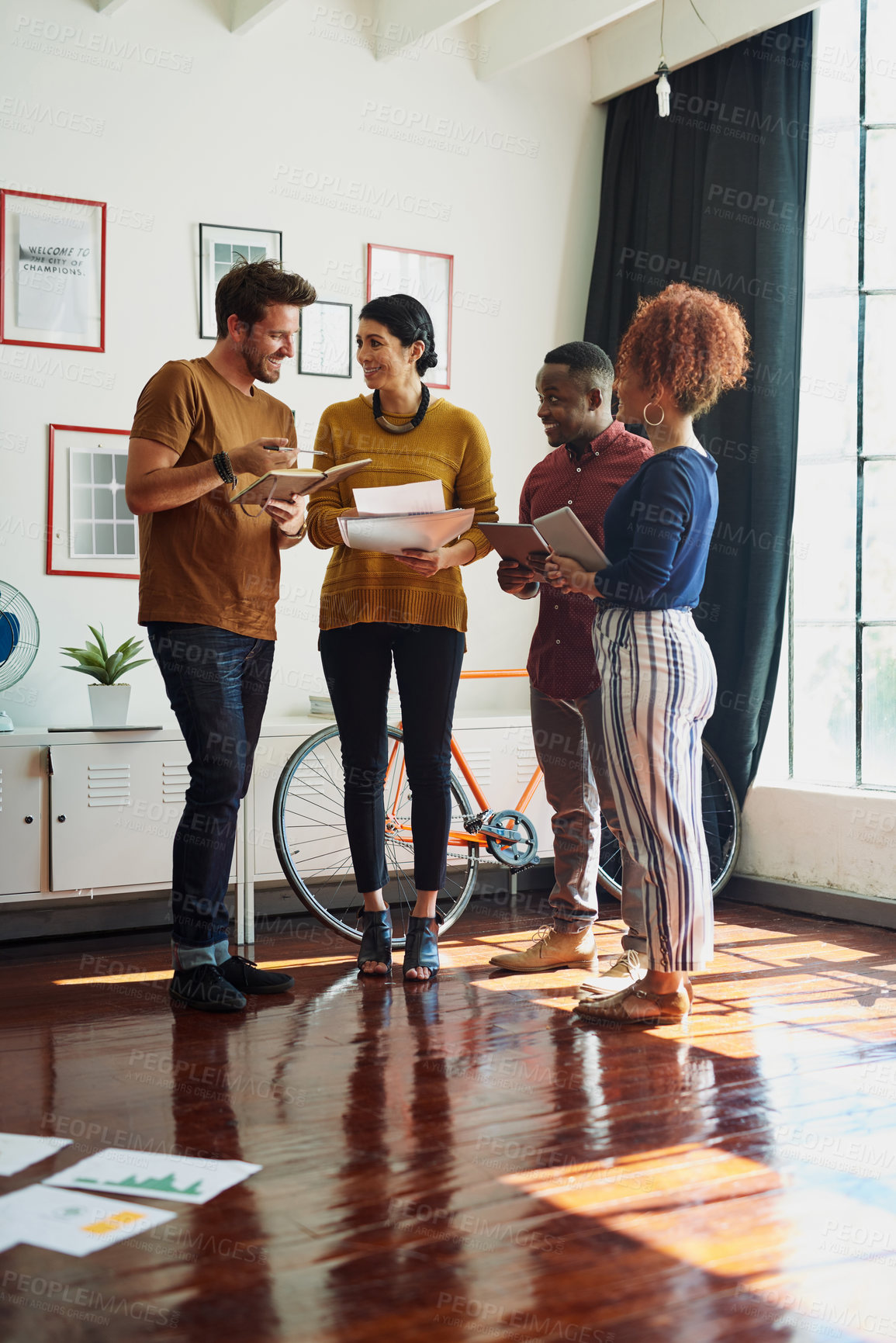 Buy stock photo Shot of a group of creative workers having a brainstorming session in an office