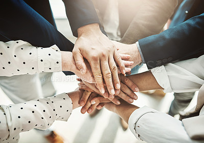 Buy stock photo Shot of a group of unrecognizable businesspeople's hands forming a huddle together inside of the office