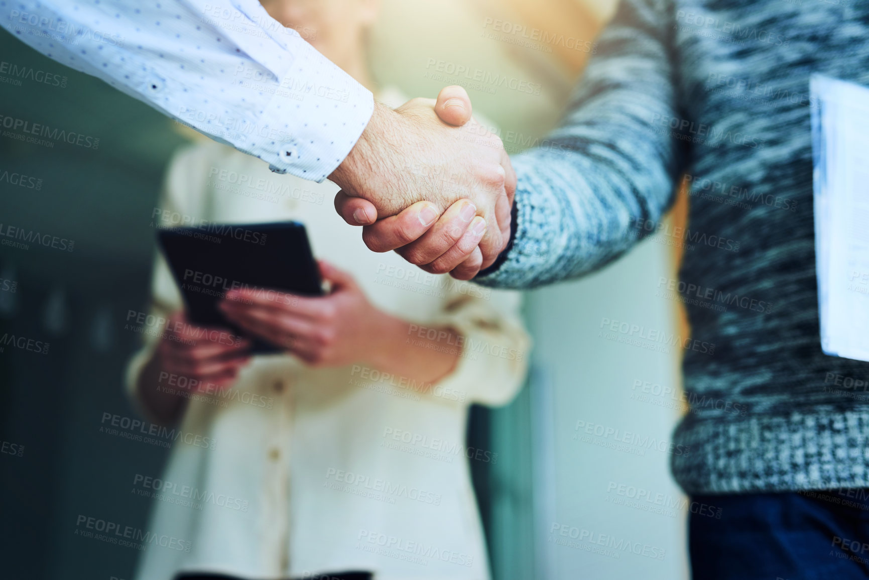 Buy stock photo Closeup shot of unrecognizable businesspeople shaking hands in an office