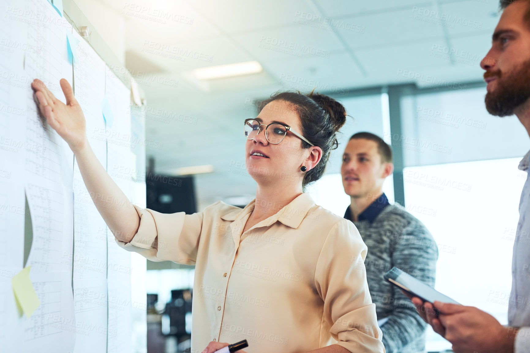 Buy stock photo Shot of a group of businesspeople brainstorming in an office