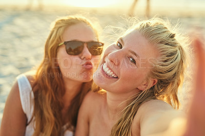 Buy stock photo Portrait, lesbian and couple with selfie at beach for summer photography, vacation and social media post. Smile, lgbtq and women for romance with profile picture update, bonding and travel together