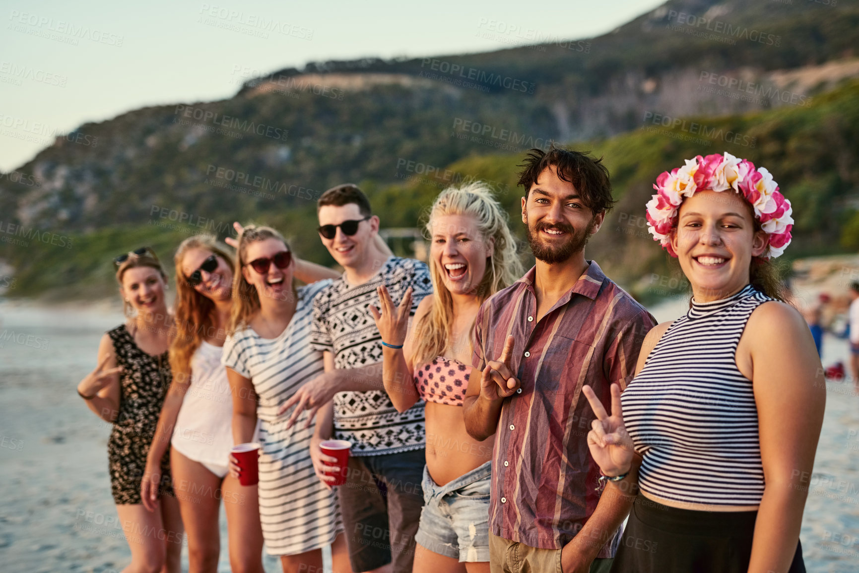 Buy stock photo Portrait, group and friends with happy at beach for summer vacation, bonding and travel together in Miami. Smile, people and reunion party with sunshine, peace sign and celebrate on tropical island