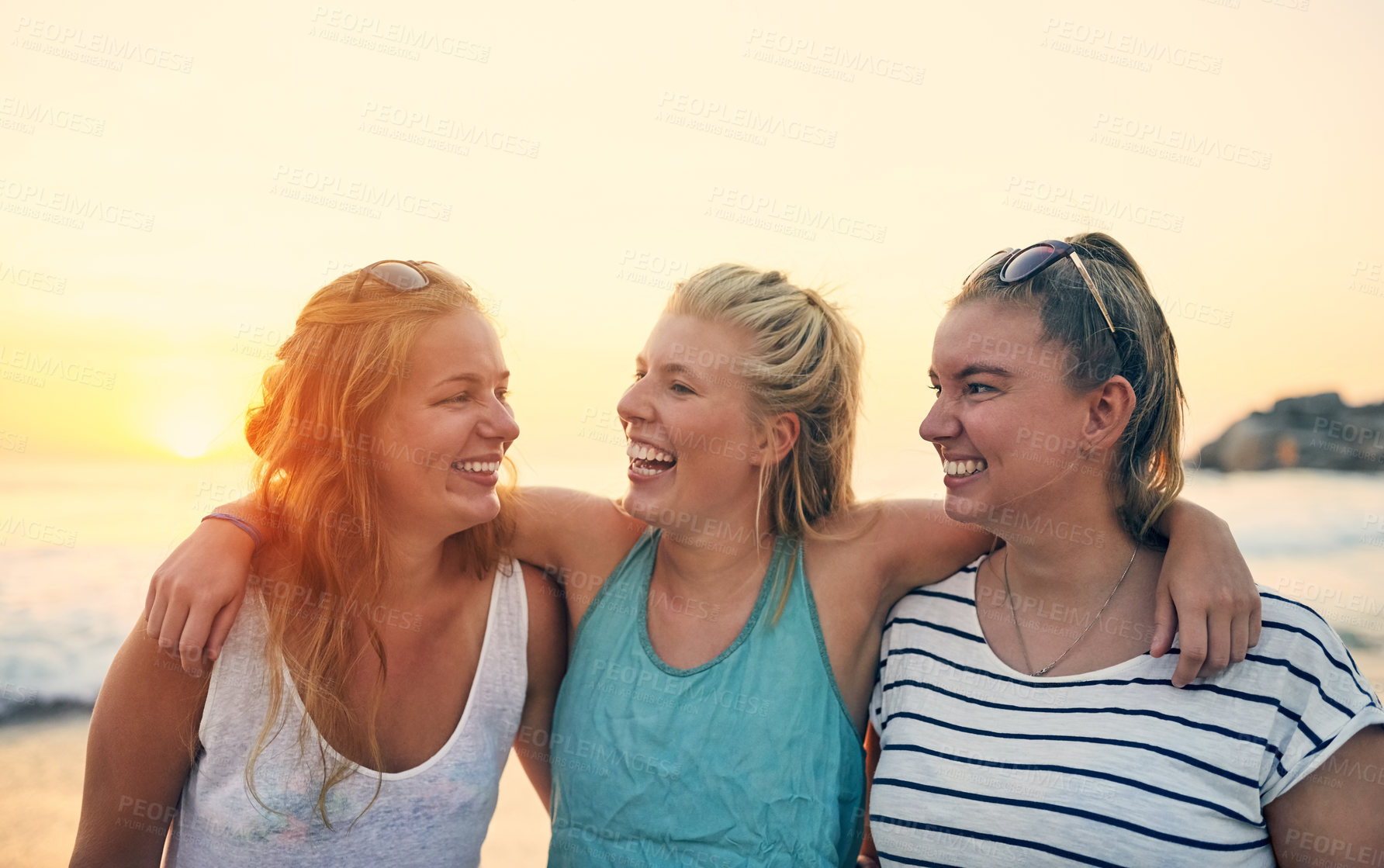 Buy stock photo Shot of young female best friends hanging out at the beach