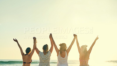 Buy stock photo Back, friends and women holding hands at beach for summer vacation, bonding and travel together in Miami. People, freedom and celebration support in sunshine for reunion, tropical sunrise and morning