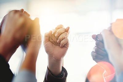 Buy stock photo Cropped shot of a group of unrecognizable businesspeople holding hands