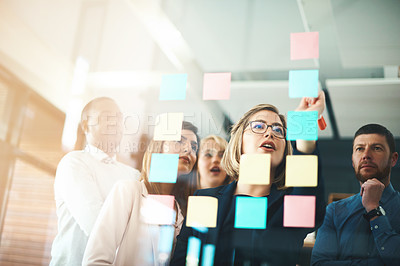 Buy stock photo Business people, teamwork and brainstorming ideas on glass for agenda, feedback and target in office. Woman, manager and employees planning schedule of project, timeline and mindmap with sticky note