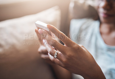 Buy stock photo Relax, hands or woman typing on a phone for social media, searching content or notification at home. Closeup, browsing website or person posting, chatting or texting on online networking mobile app 