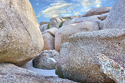 Buy stock photo Rocks, beach sand and landscape with travel and environment, holiday destination in South Africa with nature outdoor. Coastal location, natural scenery and fresh air, seascape and tropical adventure