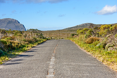 Buy stock photo Road, mountain and nature with blue sky for travel, route or landscape of outdoor wilderness. Asphalt, gravel or greenery with path, bushes or natural conservation for journey, adventure or trail