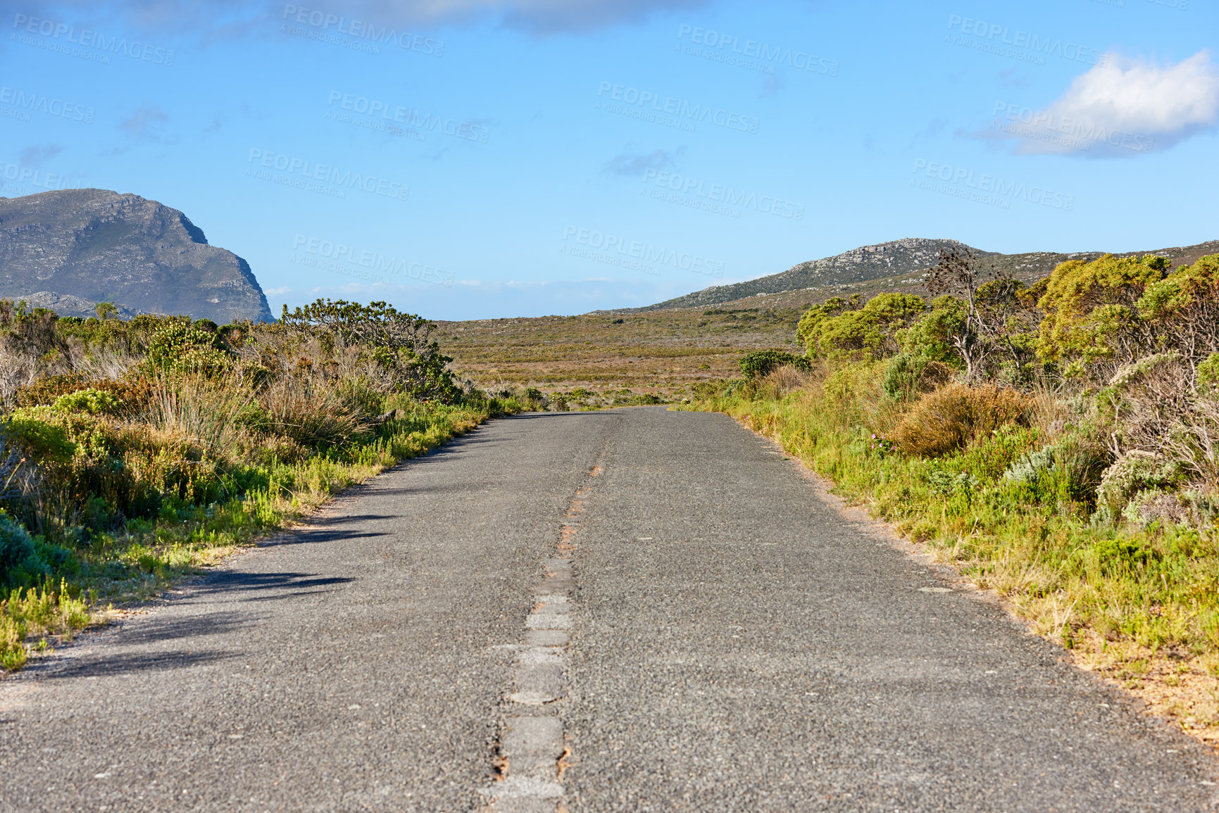 Buy stock photo Road, mountain and nature with blue sky for travel, route or landscape of outdoor wilderness. Asphalt, gravel or greenery with path, bushes or natural conservation for journey, adventure or trail