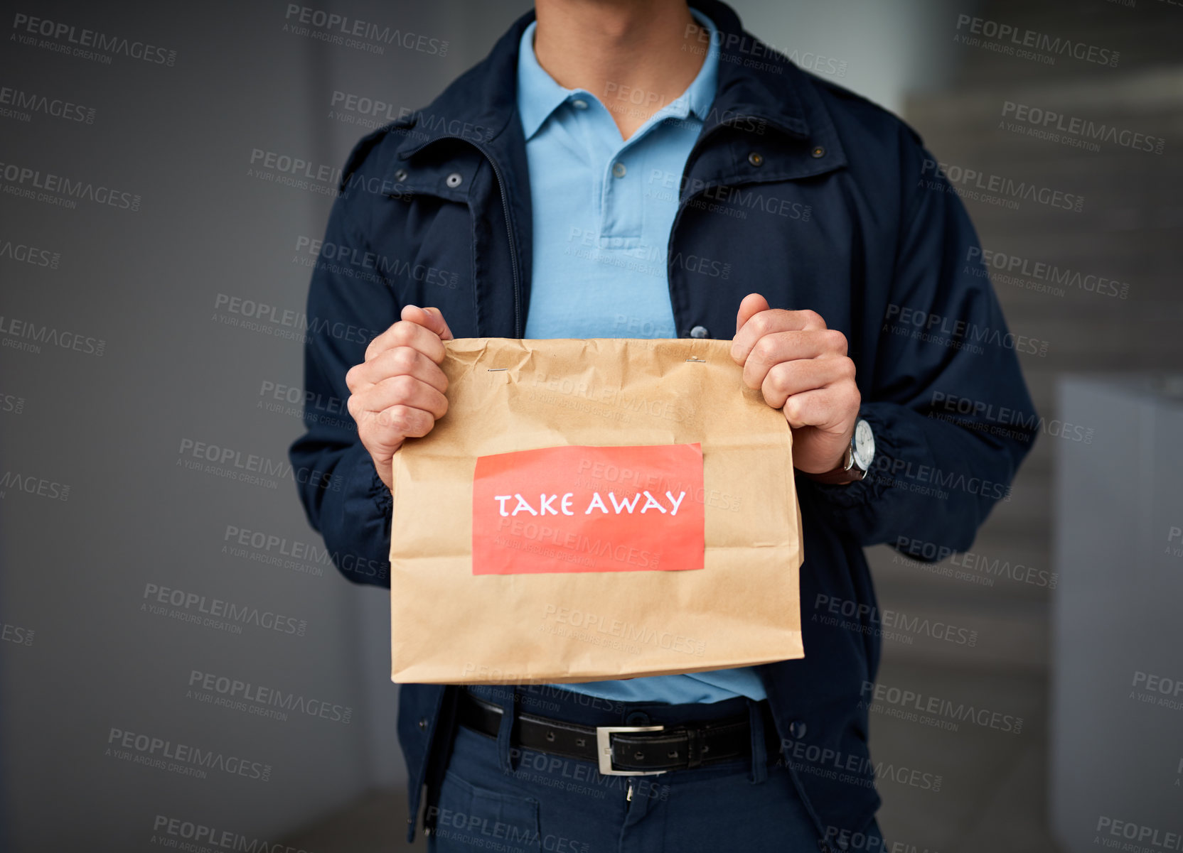 Buy stock photo Cropped shot of an unrecognizable man delivering take away food