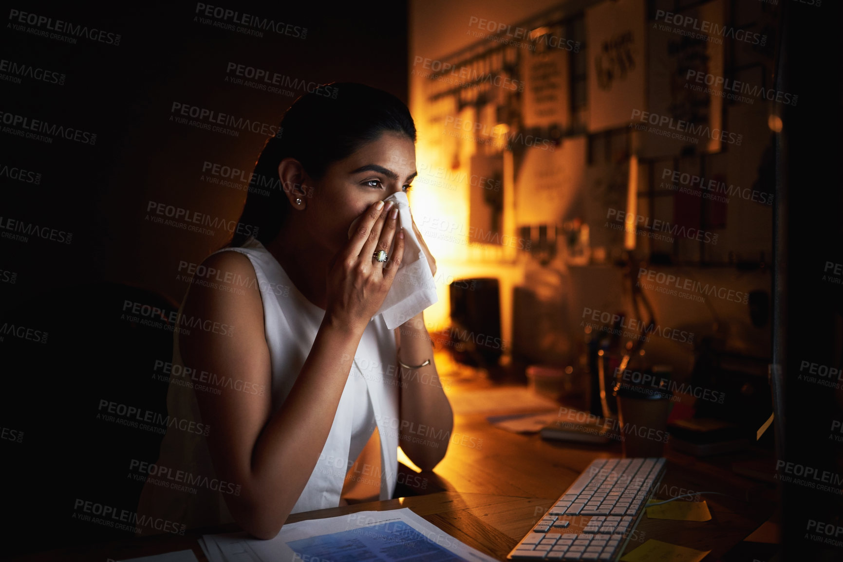 Buy stock photo Business, woman and tissue at night in office for flu virus, allergies problem and medical crisis of wellness. Female person, sick and sneeze for bacteria, health or infection of deadline pressure