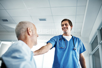 Buy stock photo Doctor, patient pov and smile in hospital for healthcare, support and service for wellness. Medical professional or expert, happy and elderly man with dementia or Alzheimers in clinic for treatment