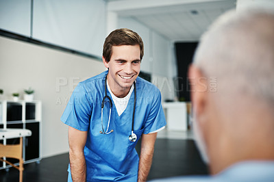 Buy stock photo Shot of a male nurse caring for a senior patient