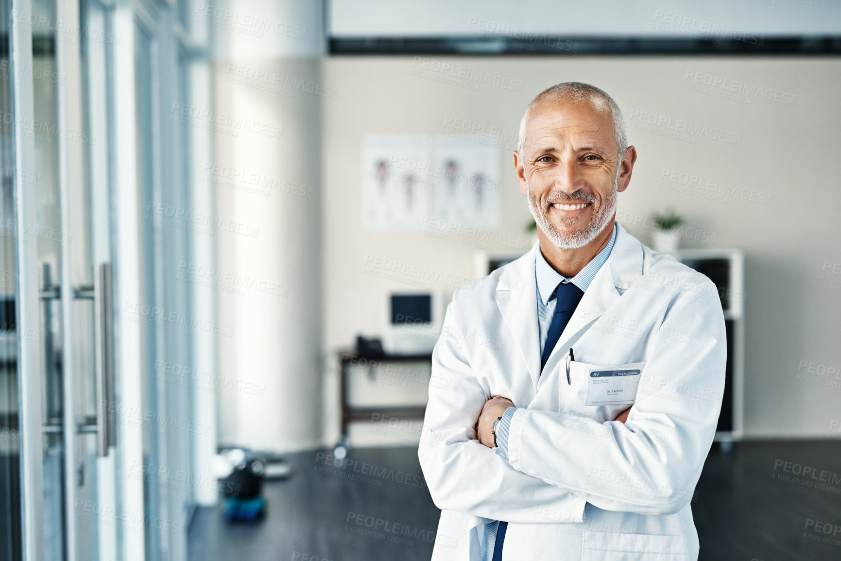 Buy stock photo Mature doctor, worker and portrait with arms crossed in hospital feeling proud from medical work. Healthcare, wellness and physician employee smile with happiness from health support and mockup