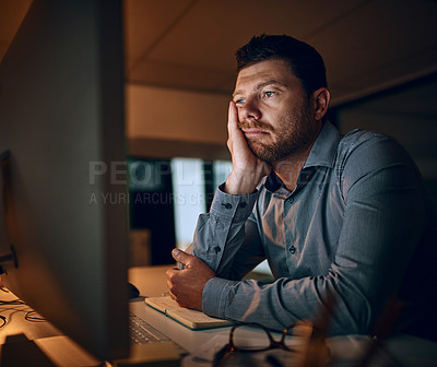 Buy stock photo Reading, tired and business man at desk by computer for fatigue, overtime or project deadline in office. Bored, publishing agency and male employee for exhausted, online report or decision at night