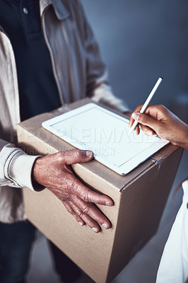 Buy stock photo Shot of a unrecognizable man handing over a package to a customer and letting them sign on a digital tablet
