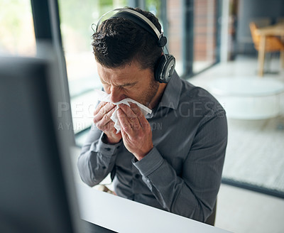 Buy stock photo Man, call center and tissue for nose by computer with consulting, sick or flu on voip. Agent, headphones and toilet paper, mucus and allergies for tech support, telemarketing and customer care at job