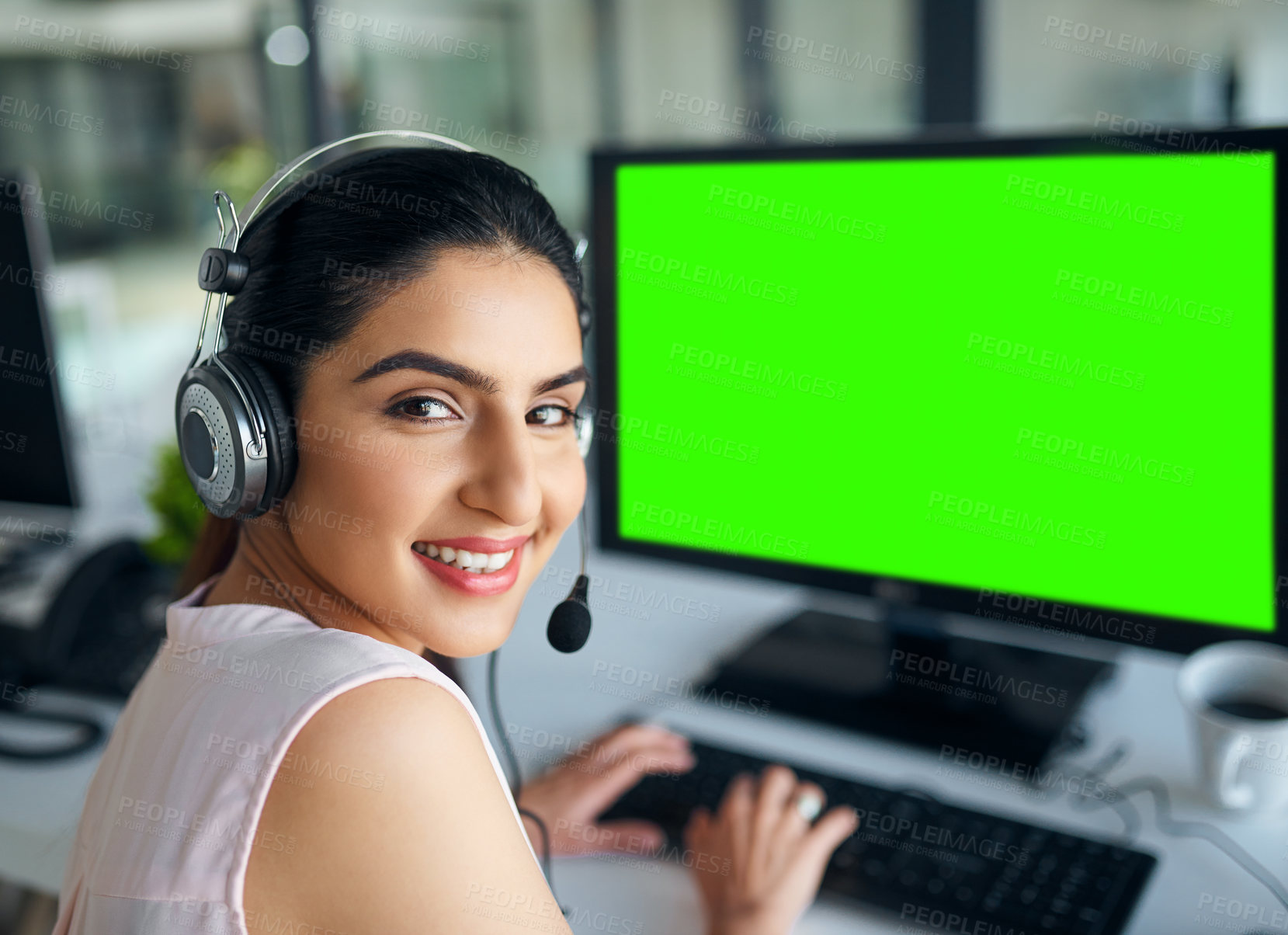 Buy stock photo Portrait of a young woman working on a computer in a call centre